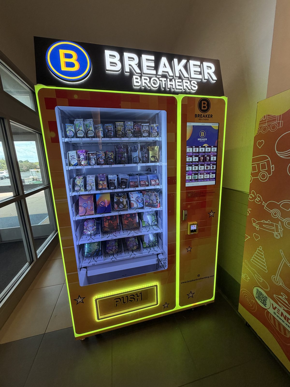 Breaker Brothers custom wrapped vending machine with yellow LED lighting